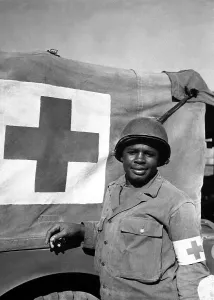 Red Cross Prints: Private Warren Capers and aided over 330 soldiers on a D-Day
