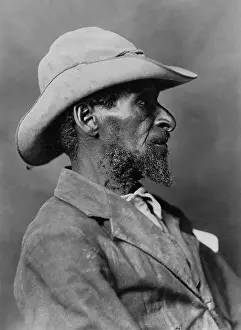 Lcgr1712 Prints: Profile portrait of African American man wearing a hat