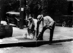 Images Dated 27th February 2008: Prohibition, pouring whiskey into a sewer, circa 1909-1932