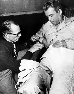 Bill Prints: Prop man Bill Sapp screws James Stewart into a plaster cast on the set of Alfred Hitchcock's REAR WINDOW