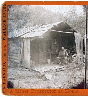 Log Cabin Prints: Prospector Archie Smith on the porch of his cabin