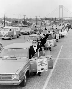 Breathing Prints: Protesters of Operation Breath Free wear surgical masks as they enter their cars at South Beach