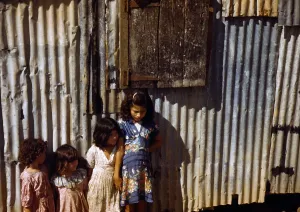 Latina Prints: Puerto Rico. Children of tenant farmers in a company housing settlement