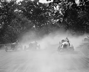 Speed Prints: Five racing cars round the track bend in a cloud of dust at the Rockville, MD fair in 1923