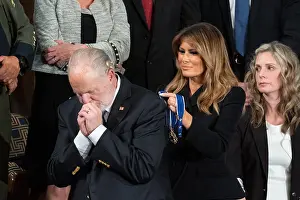 Rush Prints: Radio personality Rush Limbaugh becomes emotional as First Lady Melania Trump presents him with the Presidential Medal