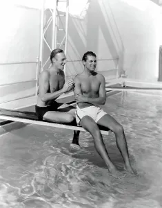Swimming Pool Prints: RANDOLPH SCOTT and CARY GRANT poolside at their Santa Monica beach front house, 1935