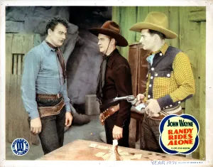 February Prints: RANDY RIDES ALONE, John Wayne, (left), 1934