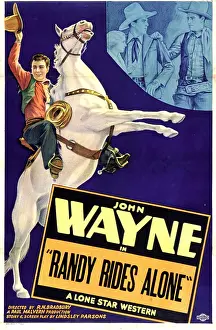 Arm Raised Prints: RANDY RIDES ALONE, left: John Wayne, 1934