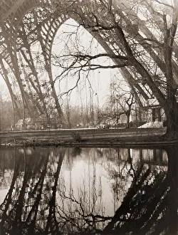 Worlds Fair Prints: A rare unpopulated winter view of the girders of the Eiffel Tower reflected in the placid waters beneath the tower