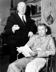 Script Prints: REAR WINDOW, from left: director Alfred Hitchcock, James Stewart on set, 1954