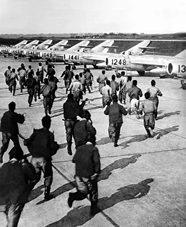 Airmen Prints: Red Chinese Army Mig Pilots rush to their planes during training at an unidentified air base in Red China