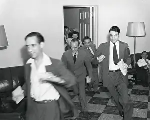 Reporters Prints: Reporters running through the White House after the announcement of Japan's surrender