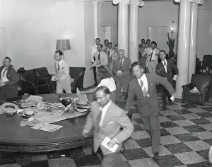 Reporters Prints: Reporters running through the White House after the announcement of Japan's surrender