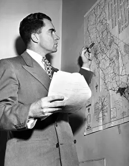 Staged Prints: Representative Richard Nixon studies his campaign map during his campaign for Senator