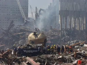 9 11 Prints: Rescue crews amid the debris of the World Trade Center including THE SPHERE a sculpture by German sculptor Fritz Koenig