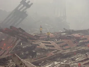 9 11 Prints: Rescue workers walk over The Pile of the ruins of the World Trade Center