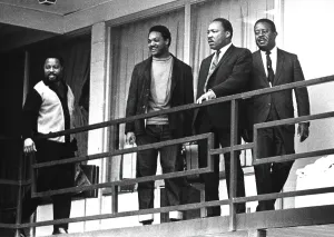 Assassination Prints: Rev. Martin Luther King stands on a balcony at the Lorraine Motel in Memphis