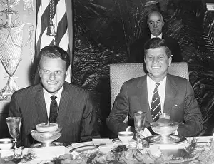 Graham Prints: Reverend Billy Graham and President John Kennedy seated at a Prayer Breakfast