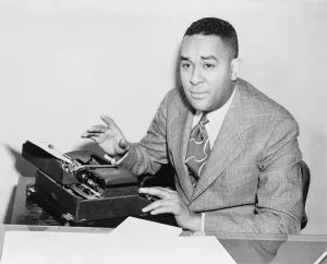 Typewriter Prints: Richard Wright (1908-1960), seated at typewriter in 1945