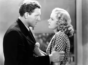Grabbing Arm Prints: RIFFRAFF, from left, Spencer Tracy, Jean Harlow, 1936
