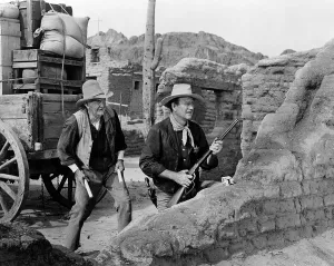 Shotgun Prints: RIO BRAVO, Walter Brennan, John Wayne, 1959.. Courtesy: CSU Archives / Everett Collection