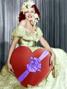 Heart Shaped Prints: Rita Hayworth poses with a giant heart, ca. 1930s