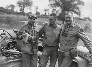 Jeep Prints: Robert Capa (left) and Ernest Hemingway (right) with their driver U