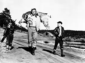 Walking Prints: Robert Mitchum (center), and his sons