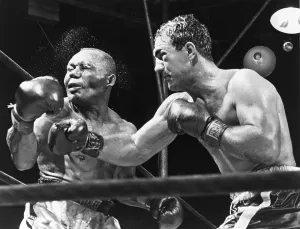 Heavyweights Prints: Rocky Marciano landing a punch on Jersey Joe Walcott during their Sept