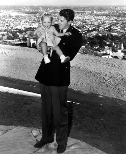 Reagan Prints: Ronald Reagan holding Maureen Reagan, 1943. Courtesy: CSU Archives / Everett Collection