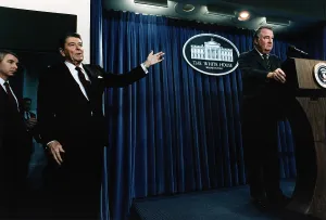 Images Dated 9th March 2009: Ronald Reagan. President Reagan motioning to Attorney General Ed Meese during a White House Press Briefing