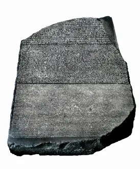The Rosetta Stone. ca. 196 BC. Decree on the royal cult written in the first aniversary of the crowning of Ptolemy V. Written in hieroglyphic script (upper part), demotic (central part) and Greek