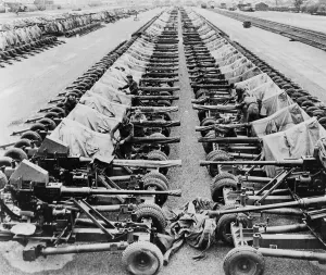 Lcgr1402 Prints: Rows of 40mm Bofors light anti-aircraft guns beside railroad tracks in England