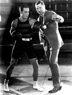 Teaching Prints: Ruldolph Valentino and heavyweight boxing champion Jack Dempsey at5 Valentino's studio in Hollywood