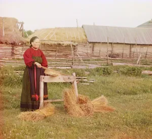 Artisans Prints: Russian peasant woman braking dried flax in a scutcher
