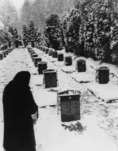 Lcgr1310 Prints: Russian woman in a snow-covered military cemetery