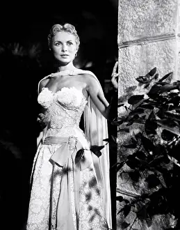 Lace Dress Prints: SAFARI, Janet Leigh, in a blue silk dress overlaid in white lace by Olga Lehmann, 1956