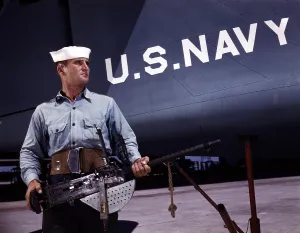 Images Dated 1st August 2007: A sailor holds a.30 caliber machine gun at the Naval Air Base, Corpus Christi, TX, 1942