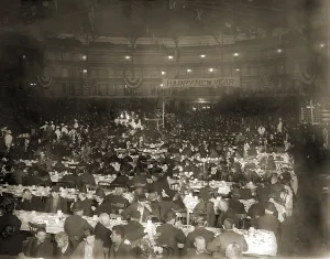 Holidays Prints: Salvation Army's New Year's Dinner in a large auditorium was attended mostly by men