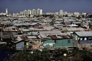 Crowded Prints: San Juan Puerto Rico. Modern buildings contrast with shanties along the Martin Pena Canal