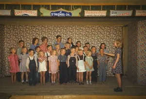 December Prints: School children some barefoot singing on a stage Pie Town New Mexico