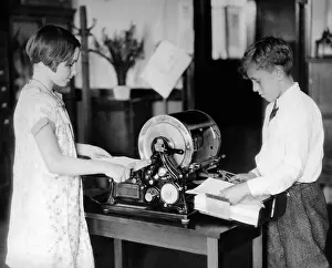 Old Technology Prints: School children work on a mimeograph machine