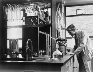 Research Prints: Scientist conducting a laboratory experiment in a cancer research facility in the United States