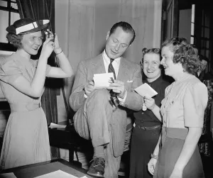 Fans Prints: Screen actor Robert Montgomery, autographing for women fans at the U.S. Capitol