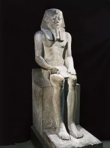 Seated statue of Sesostris I. 1971 -1928 BC. Egyptian art. Middle Kingdom. Sculpture on rock. EGYPT. Cairo. Egyptian Museum. Proc: EGYPT. Al-Lisht