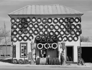 Retail Prints: Secondhand tires displayed for sale at San Marcos, Texas. 1940 photograph by Russell Lee