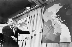 Marions Prints: Secretary of Defense Robert McNamera pointing to a map of Vietnam at a press conference