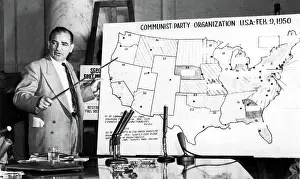 Sen. Joseph McCarthy before Senate Committee, 1950s, pointing to U.S. map. Courtesy: CSU Archives / Everett Collection