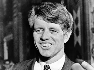 Press Prints: Sen. Robert Kennedy talking with reporters on this 42nd birthday