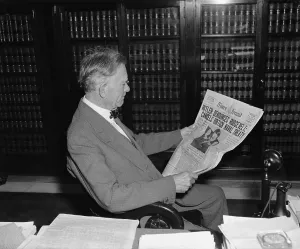 Lcgr1305 Prints: Senator Borah reads Times Herald headline about Hitler